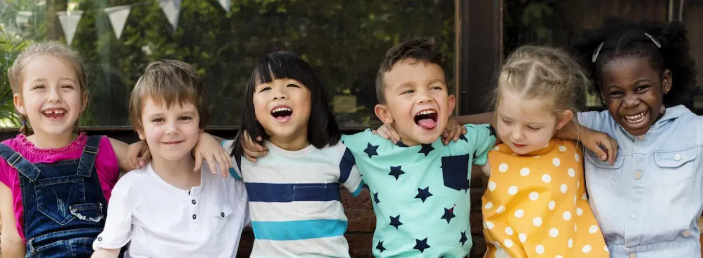 Image: children sitting in a row. Title: Community Investing Guide